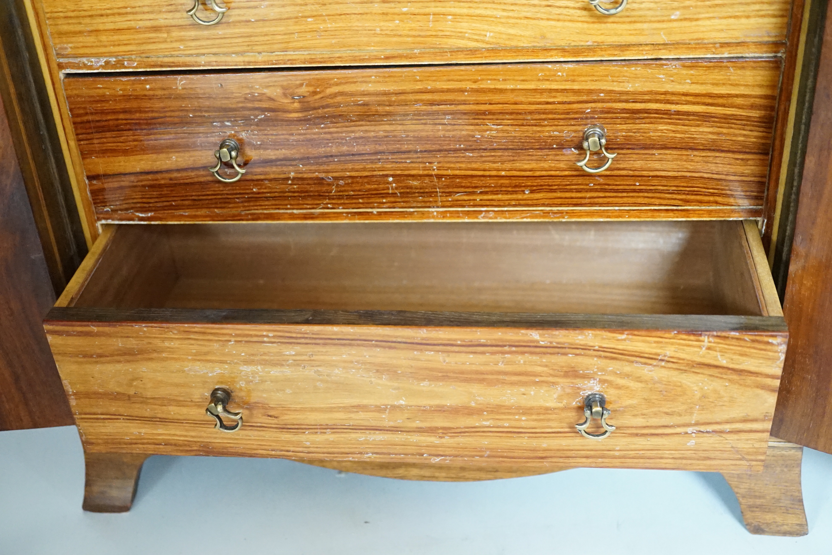 A George III style rosewood and tulipwood banded miniature two door chest, fitted with four graduated drawers, 36 x 35cm